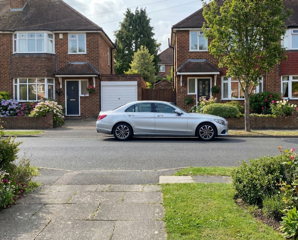 Residential street in East Preston with wheelie bins